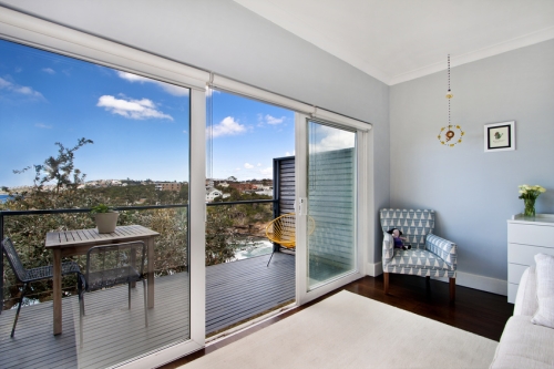 House with water view. Walkout deck with glass slide door